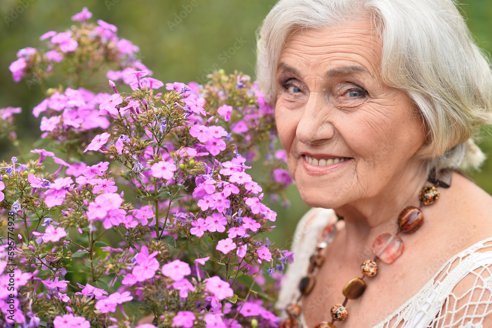 old woman takes care of a flower old woman takes care of a flower
