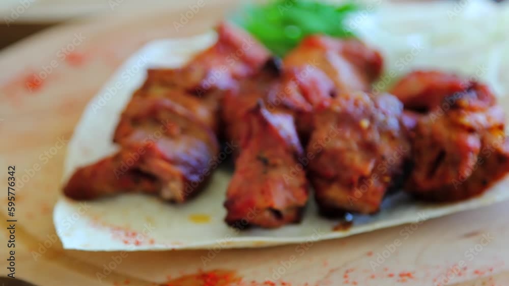 Smooth focus movement from bokeh to grilled meat on a plate. Smooth focus movement from bokeh to grilled meat on a plate.