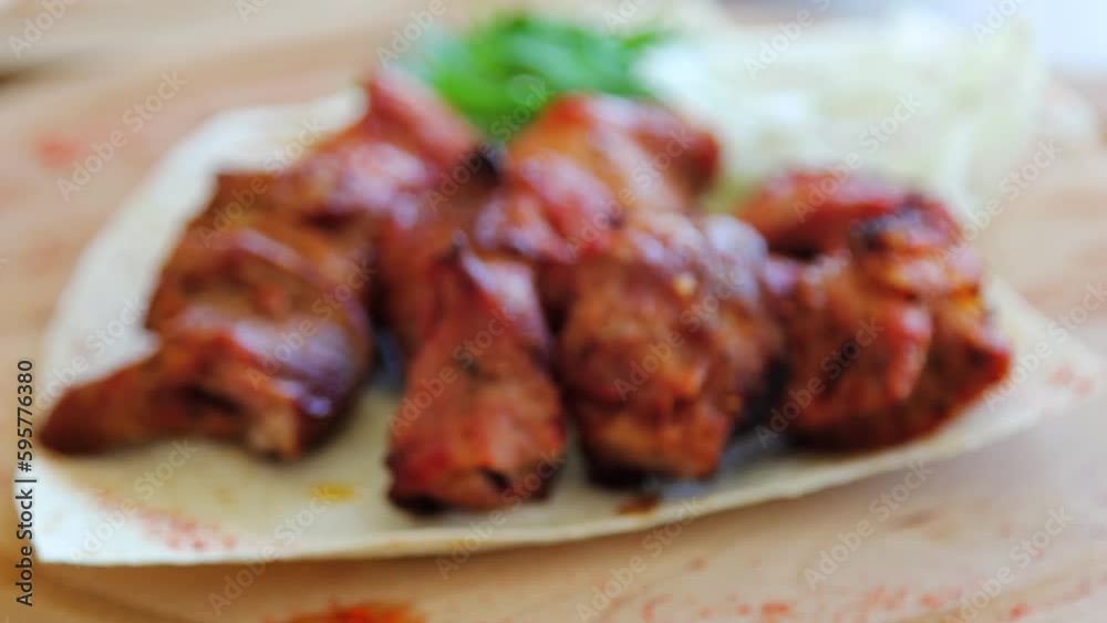 Smooth focus movement from bokeh to grilled meat on a plate. Smooth focus movement from bokeh to grilled meat on a plate.