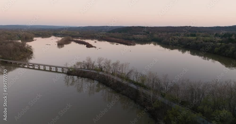 Aerial shot of a bridge connecting both shores on Lake Sequoyah at sunset Aerial shot of a bridge connecting both shores on Lake Sequoyah at sunset