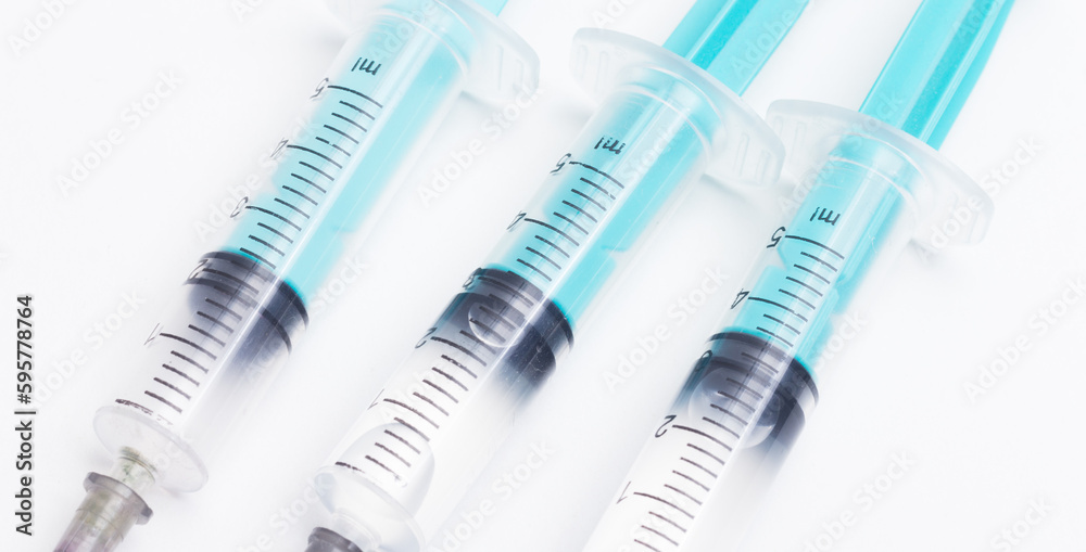 Disposable plastic syringe prepared for injection and vaccination in the hospital. The concept of medicine and health Disposable plastic syringe prepared for injection and vaccination in the hospital. The concept of medicine and health