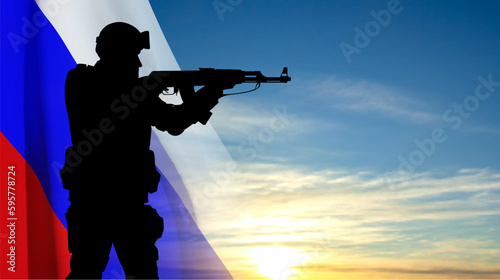Silhouette of a soldier on background of sunset sky with the Russian flag. EPS10 vector