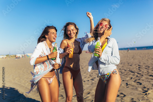 Female friends having fun at the beach on a sunny day