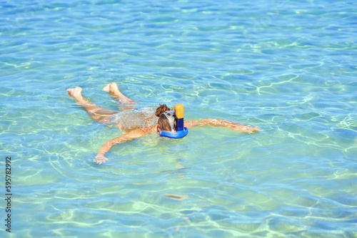 Woman snorkeling in water of Red Sea