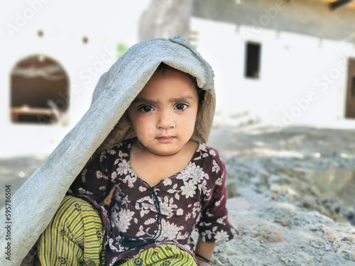young refugee little girl playing