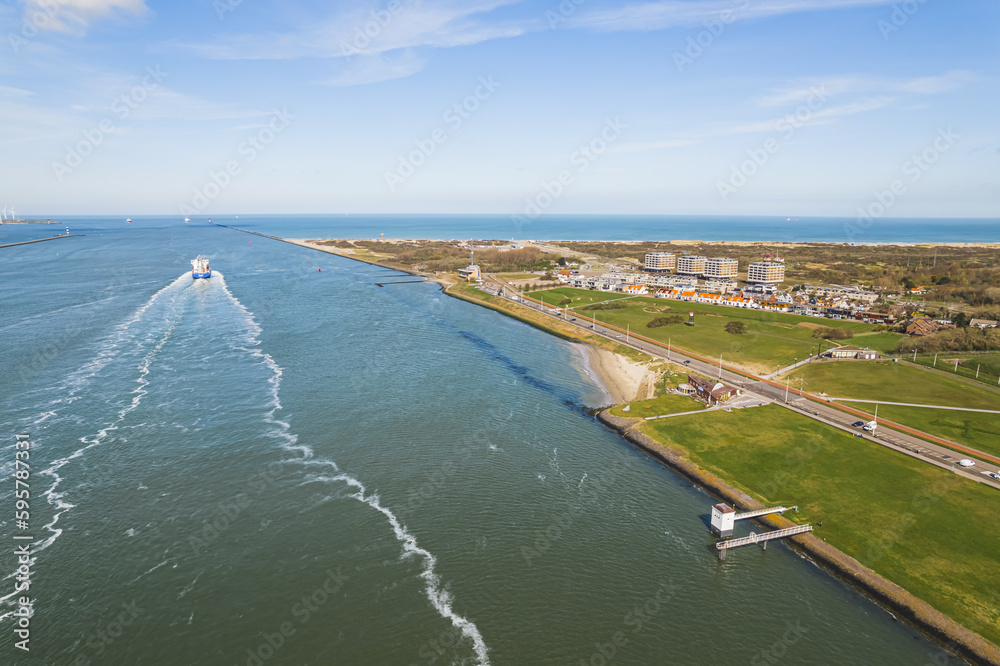 scenic drone shot of maasvlakte in Netherlands, ships sailing in the sea on a sunny day. High quality photo