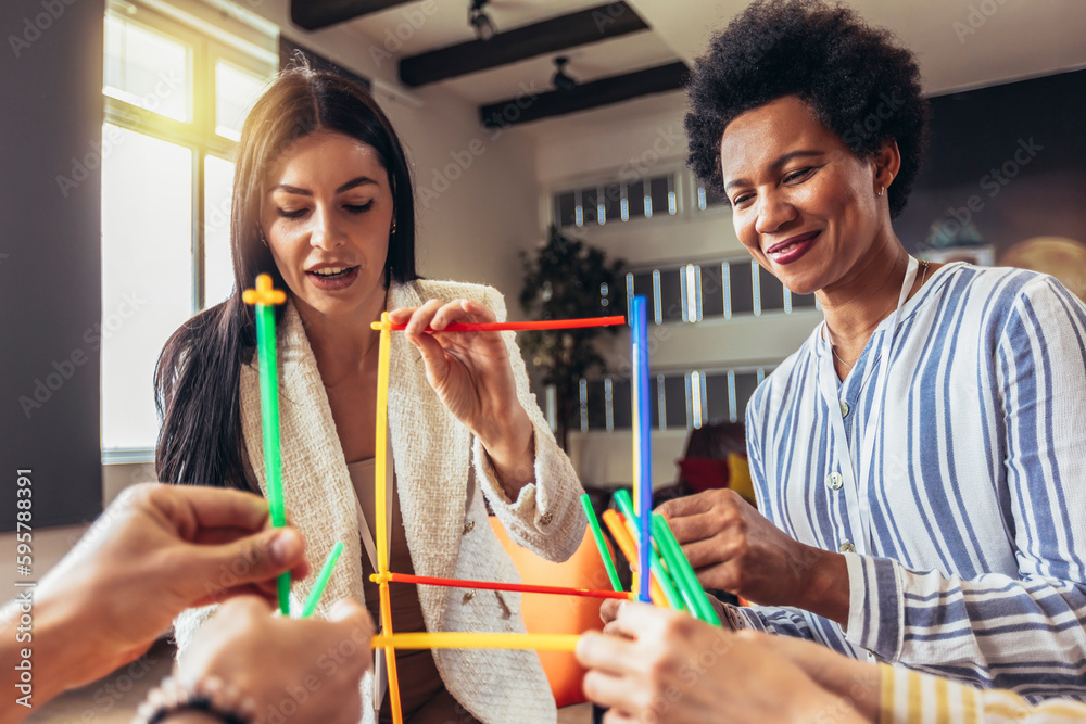 Team building activities in the office with sticks.Concept of