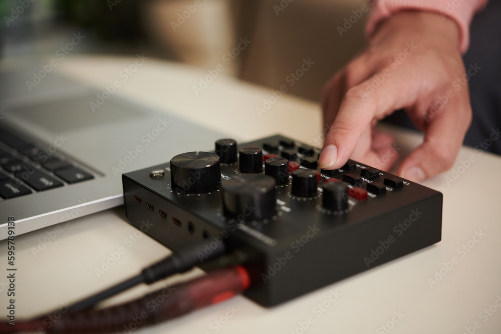 Fototapeta premium Guitar player using amplifier when recording new song at home