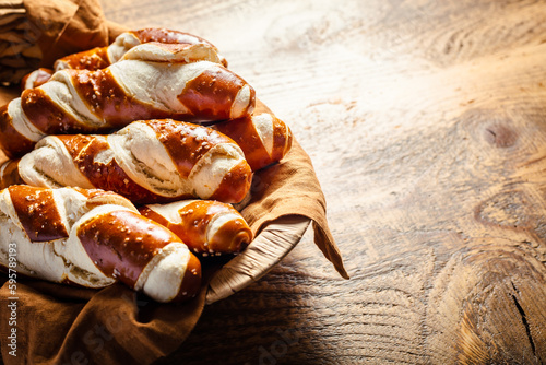 Pretzel sticks and pretzel rolls, Bavarian lye bun with salt in a basket photo
