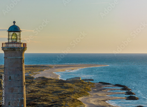 Fotografie Beach coastline with the famous Skagen Grey Lighthouse, Skagen Grå Fyr, Skagen, Grenen in North Jutland in Denmark, Skagerrak, North Sea, Baltic Sea