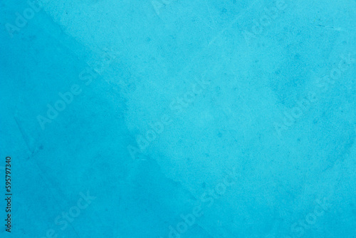 Blue concrete stone texture for background in summer wallpaper. Cement and sand wall of tone vintage. Concrete abstract wall of light cyan color.	