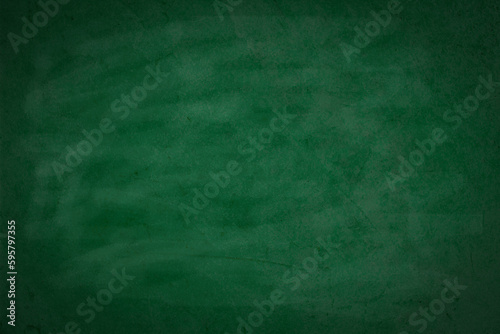 Green board. Dark green wall backdrop. Education concepts.