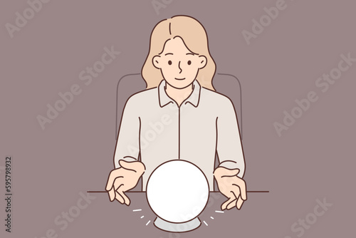 Woman uses crystal ball to predict future during seance and provide psychic services