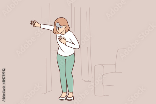 Sick woman suffering from heart or lung problems stands in apartment holding chest