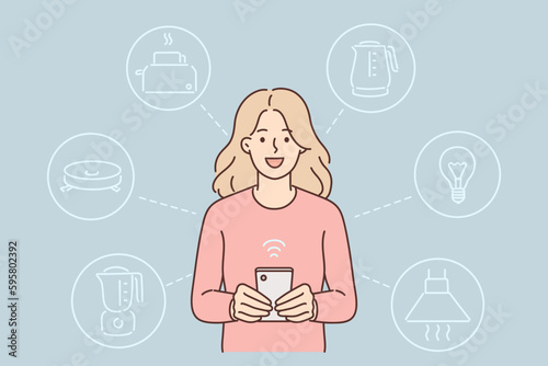 Woman controls smart home system through phone and launches iot devices connected to wi-fi