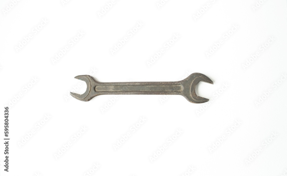 On a white isolated background, the wrench lies horizontally. Concept design and hand tools, plumbing work. Flat lay, top view, closeup, On a white isolated background, the wrench lies horizontally. Concept design and hand tools, plumbing work. Flat lay, top view, closeup,