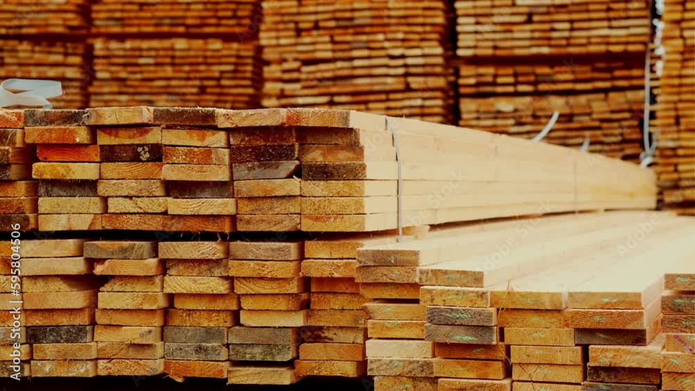 Wooden boards, lumber, industrial wood, timber. Pine wood timber stack of natural rough wooden boards on building site. Industrial timber building materials Wooden boards, lumber, industrial wood, timber. Pine wood timber stack of natural rough wooden boards on building site. Industrial timber building materials
