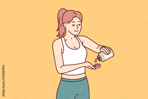 Woman fitness trainer uses sports supplements to improve health and achieve new career results. Slender beautiful fitness girl takes doping before training or important competitions 