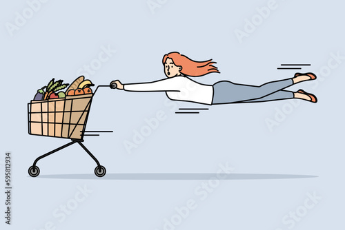 Woman pulled by shopping cart full of groceries. Frustrated female customer buying groceries in supermarket on sale or promotion. Vector illustration. 