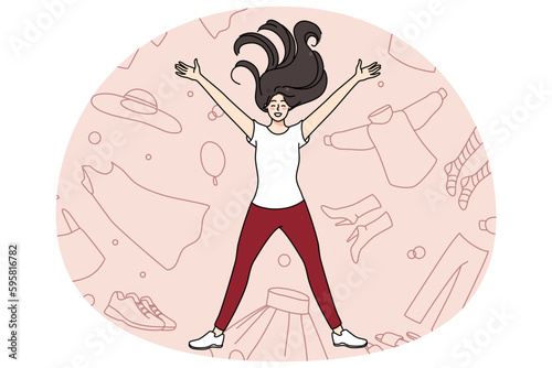Overjoyed young girl lying among clothes excited with shopping and purchase. Smiling woman shopaholic with garment and apparel. Concept of consumerism and fast fashion. Vector illustration.