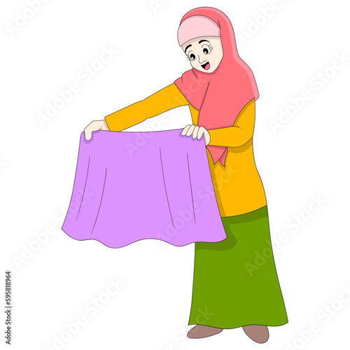 beautiful islamic girl is keeping clean washing clothes