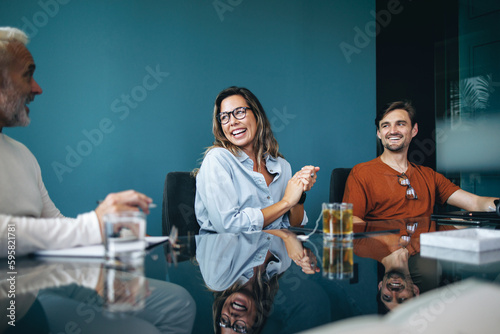 Group of successful business people having a collaborative meeting in a boardroom photo