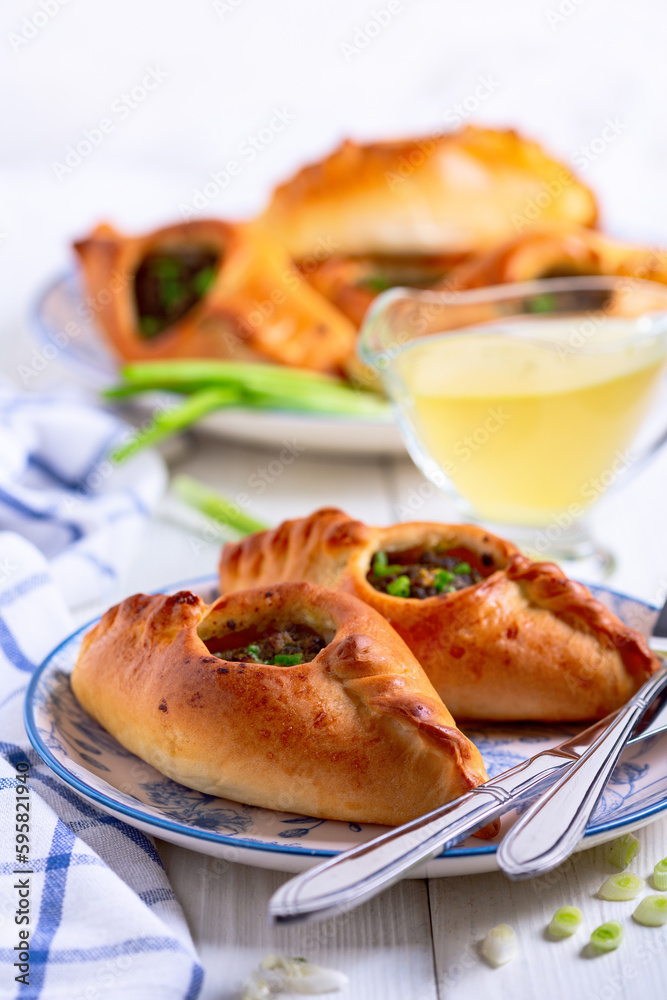 Open pies with savory filling (rastegay). Russian kitchen.