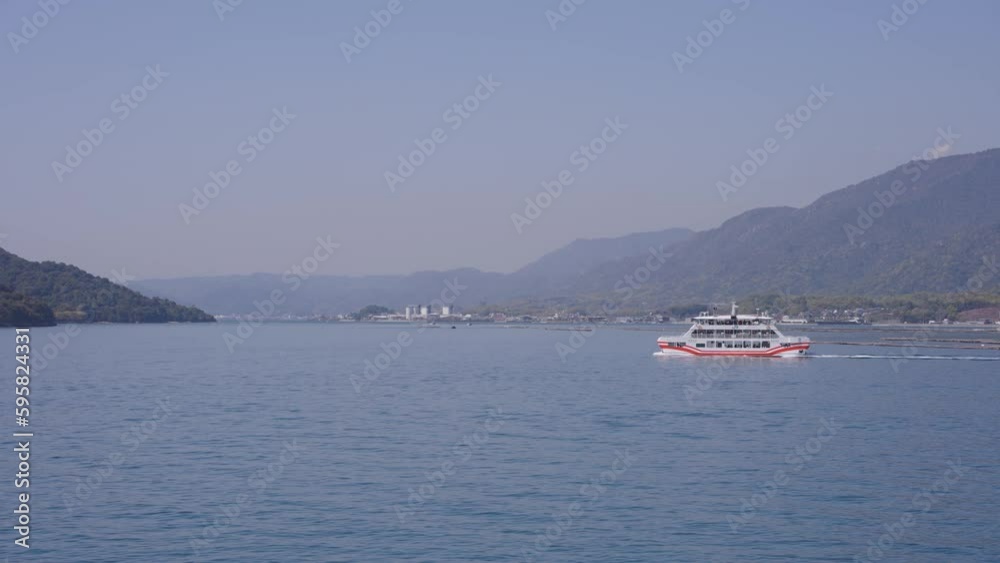 Ferry to Miyajima Island leaving Hiroshima towards Itsukushima Shrine Ferry to Miyajima Island leaving Hiroshima towards Itsukushima Shrine