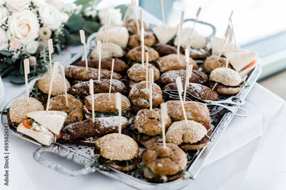 Kleine belegte Brötchen mit Spieß bei einer Feier Stock Photo | Adobe Stock