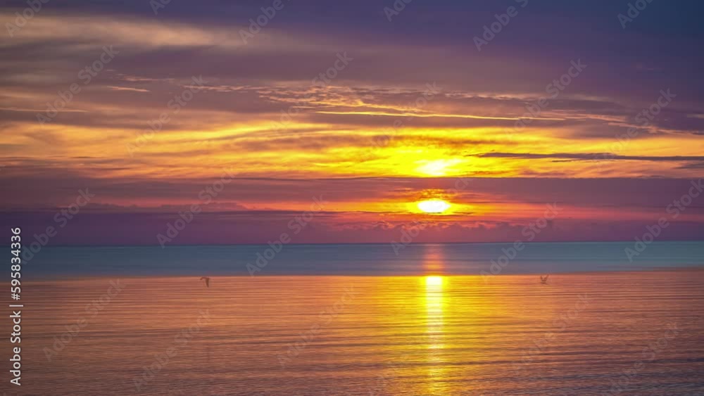 Timelapse of calm oceanside colorful sunset Timelapse of calm oceanside colorful sunset