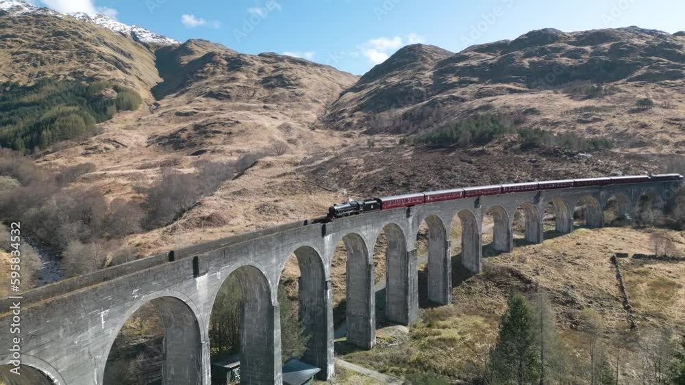 Drone Shot Reveals Famous Glenfinnan Viaduct with Jacobite Steam Engine
