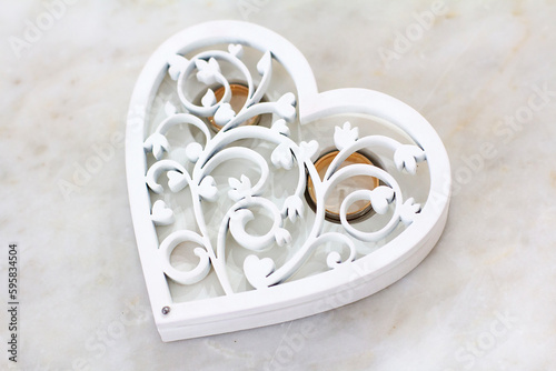 Wooden white heart-shaped miscellaneous casket with wedding rings