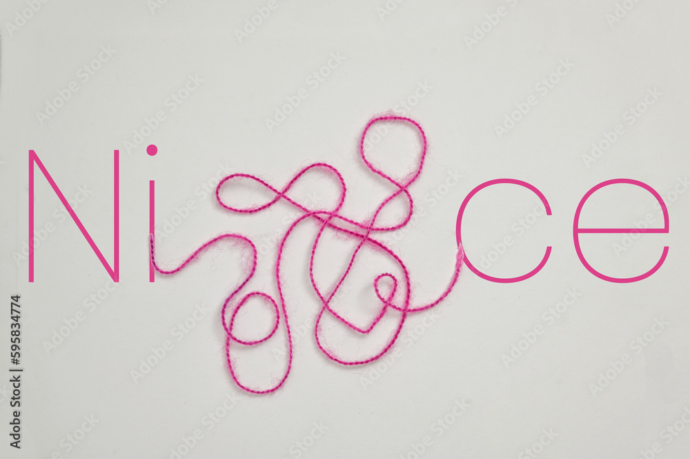 Nice word Written With Letters and Tangled Thread