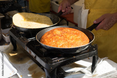 Cooking of Frico typical Friulian dish based on potatoes and cheese,italy