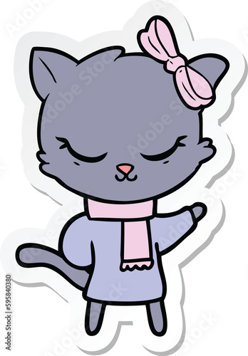 sticker of a cute cartoon cat with bow