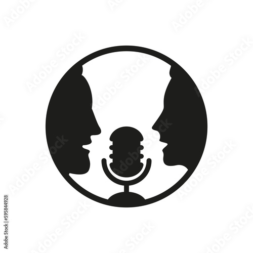 A man and a woman speak into a microphone.