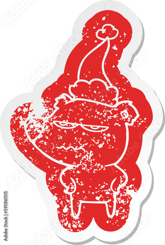 angry bear polar quirky cartoon distressed sticker of a wearing santa hat