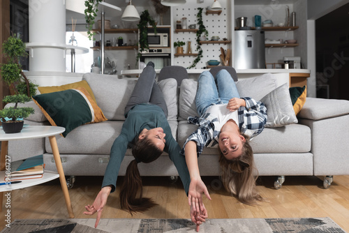 LGBT Lesbian woman couple love moments happiness concept at home having fun and nice time alone and together in their new apartment, living together