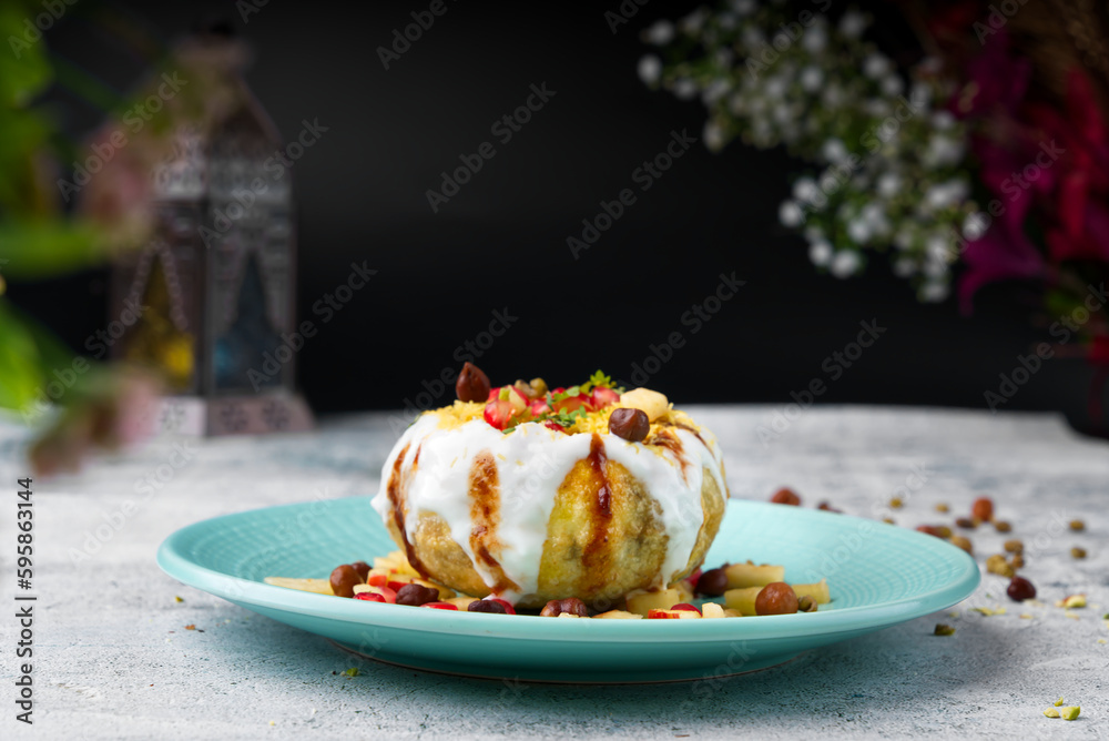Raj Kachori has crispy fried shells filled with potatoes, yogurt, boiled lentils,spices, chutney & more! It's the the ultimate Indian chaat! - obrazy, fototapety, plakaty 