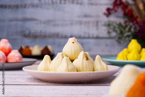 Modak are Maharashtrian festive dumplings made with rice flour dough & a sweet coconut jaggery filling photo