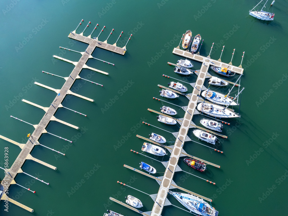 Aerial view landscape Poland Gdynia. Pier speedboat. A marina lot. This is usually the most popular tourist attractions on the beach.Yacht and sailboat is moored at the quay. Top view drone.