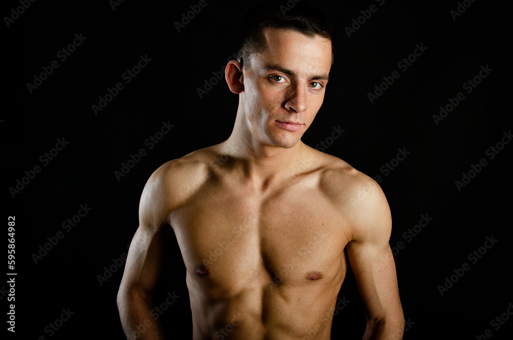 Young attractive man posing in the studio. Young attractive man posing in the studio.