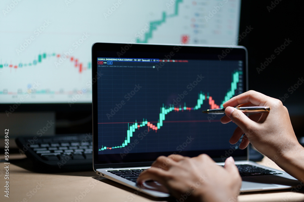 trader working in modern office, looking at display, sale and buy and analyzing index on market diagram. trader working in modern office, looking at display, sale and buy and analyzing index on market diagram.