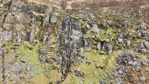 Waterford Mahon Valley Comeragh Mountains steep cliff and waterfall with scree slopes under the cliffs on a spring morning photo