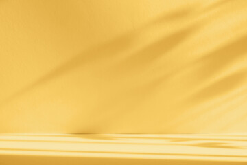 Abstract yellow color gradient studio background for product presentation. Empty room with shadows of window and flowers and palm leaves . 3d room with copy space. Summer concert. Blurred backdrop.