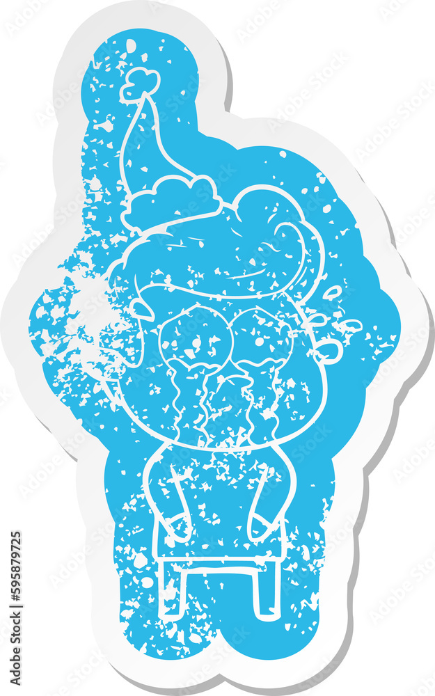 quirky cartoon distressed sticker of a crying man wearing santa hat