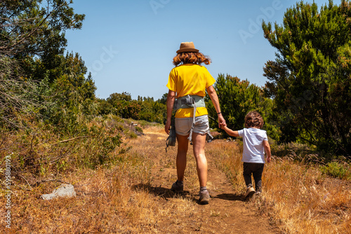 A mother with her son on a hiking trail in La Llania on El Hierro, Canary Islands