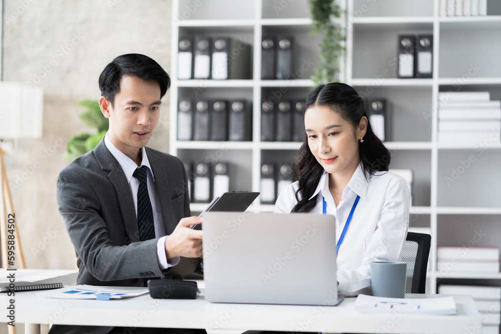 Businessmen team or financial data analysts working with tablets and laptop computers and data graphs together. Plan to analyzing projects in the office. Businessmen team or financial data analysts working with tablets and laptop computers and data graphs together. Plan to analyzing projects in the office.