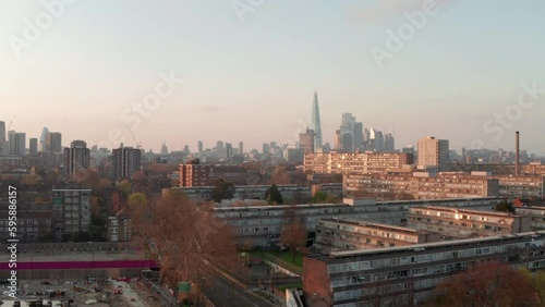 Rising aerial shot of London skyscrapers over south London council estates photo