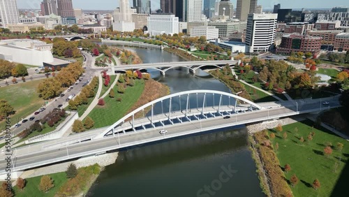 Aerial pan up of Scioto river view of downtown Columbus, Ohio photo